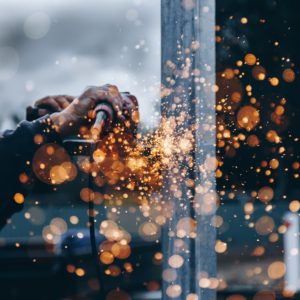 Sparks Will Fly Person Grinding Metal Surface
